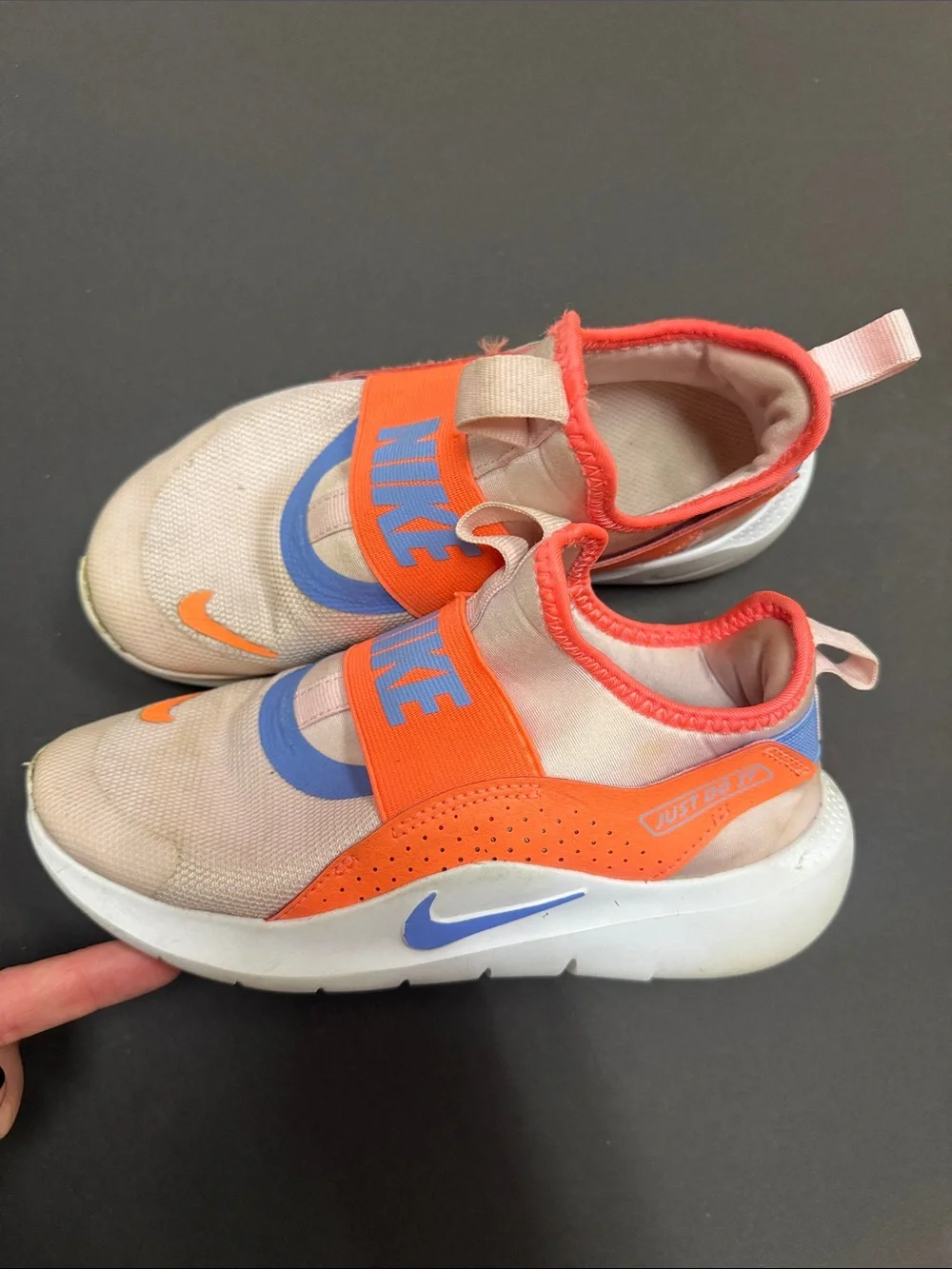Nike Kids Slip-On Sneakers in Coral Pink with Orange and Blue Accents